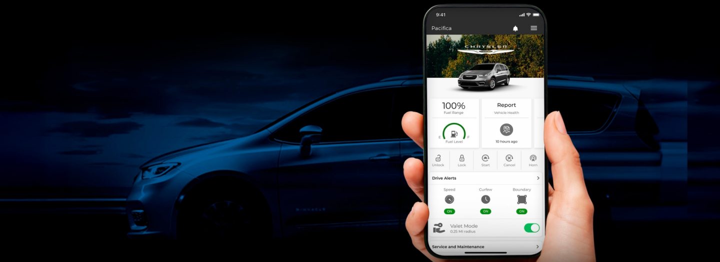 In the foreground a smartphone displaying a page from the SiriusXM Guardian app and a Chrysler Pacifica in the background with a semi-transparent dark blue wash.