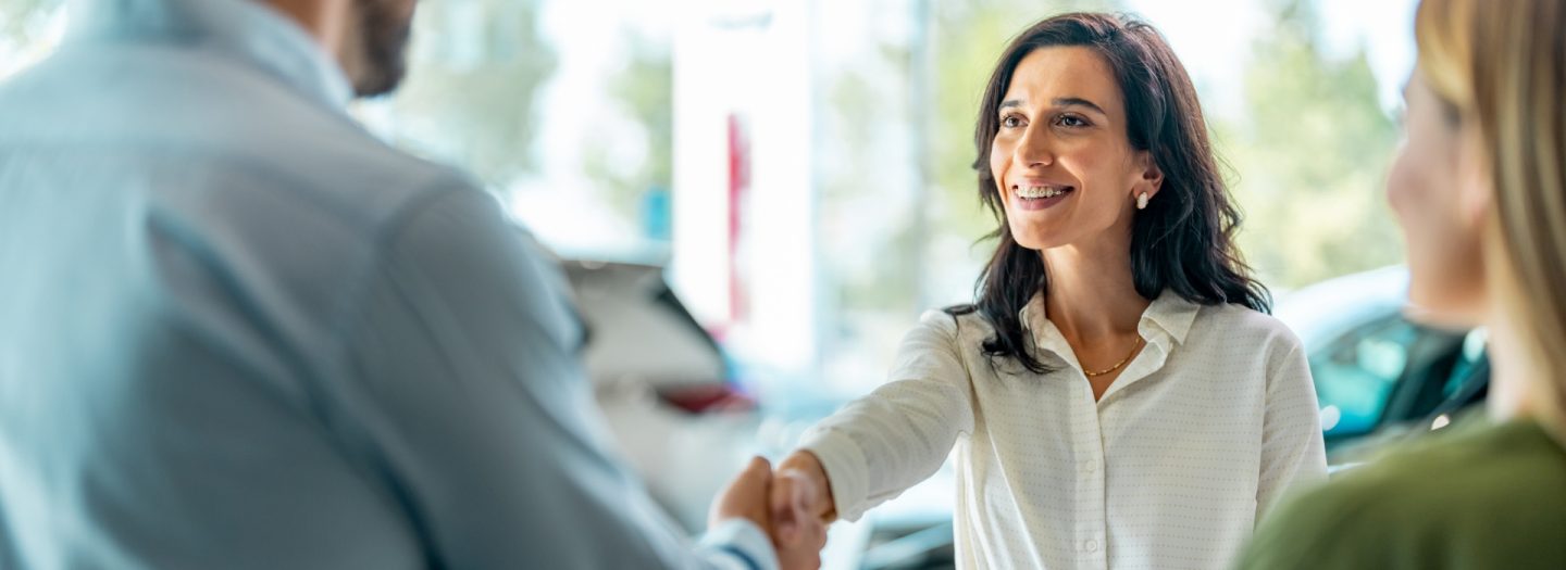 A man and woman shaking hands.
